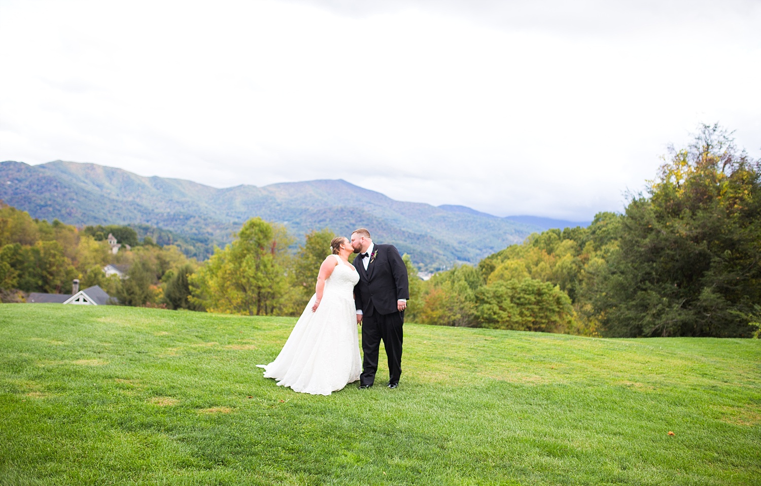 Bride and groom mountain wedding kissing