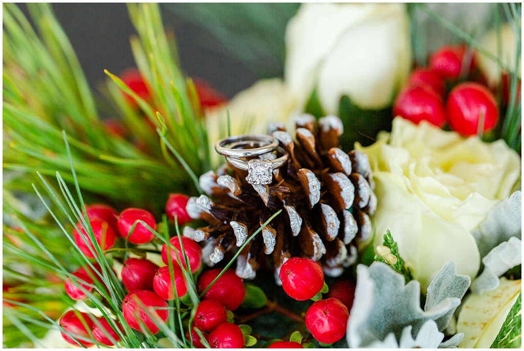 Christmas inspired wedding bouquet with the bride's rings