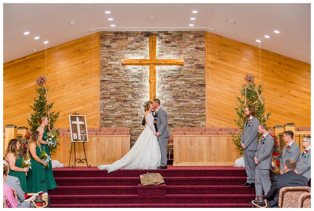 Bride and Groom share a first kiss at Victory Baptist Church during their ceremony
