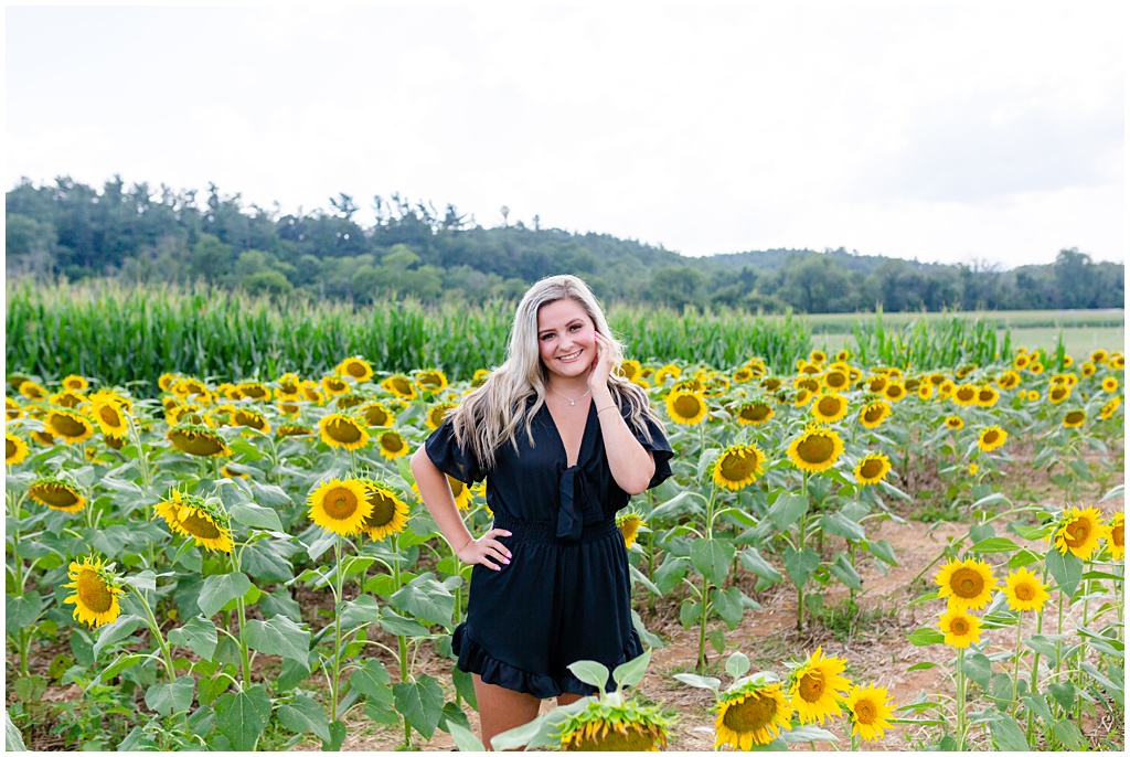 High school senior portrait of Haley in the sunflower fields.