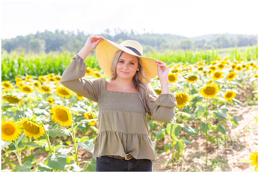 Summer southern senior portraits in a sunflower field at the biltmore