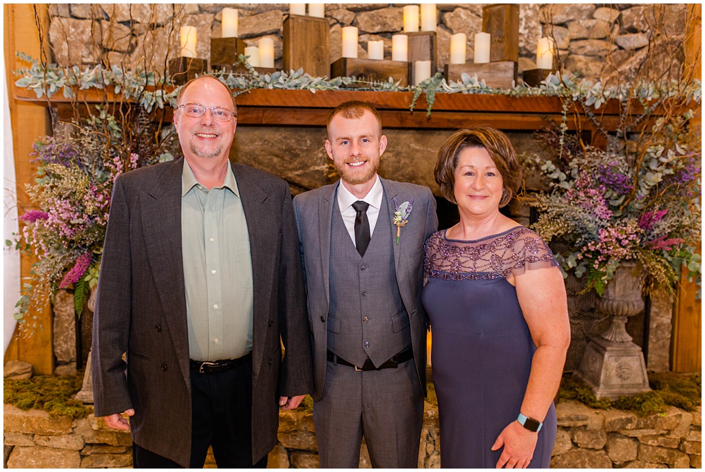 A photo of the groom with his mom and dad before the ceremony.
