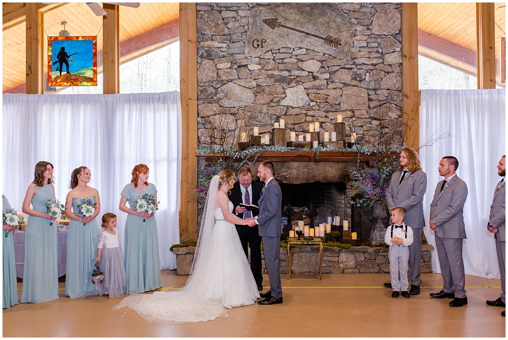 The wedding ceremony indoors at Camp Daniel Boone.