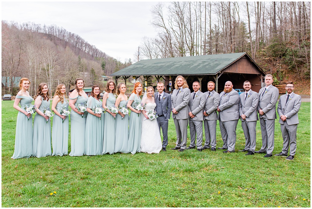 Full wedding party photo outside at Camp Daniel Boone.