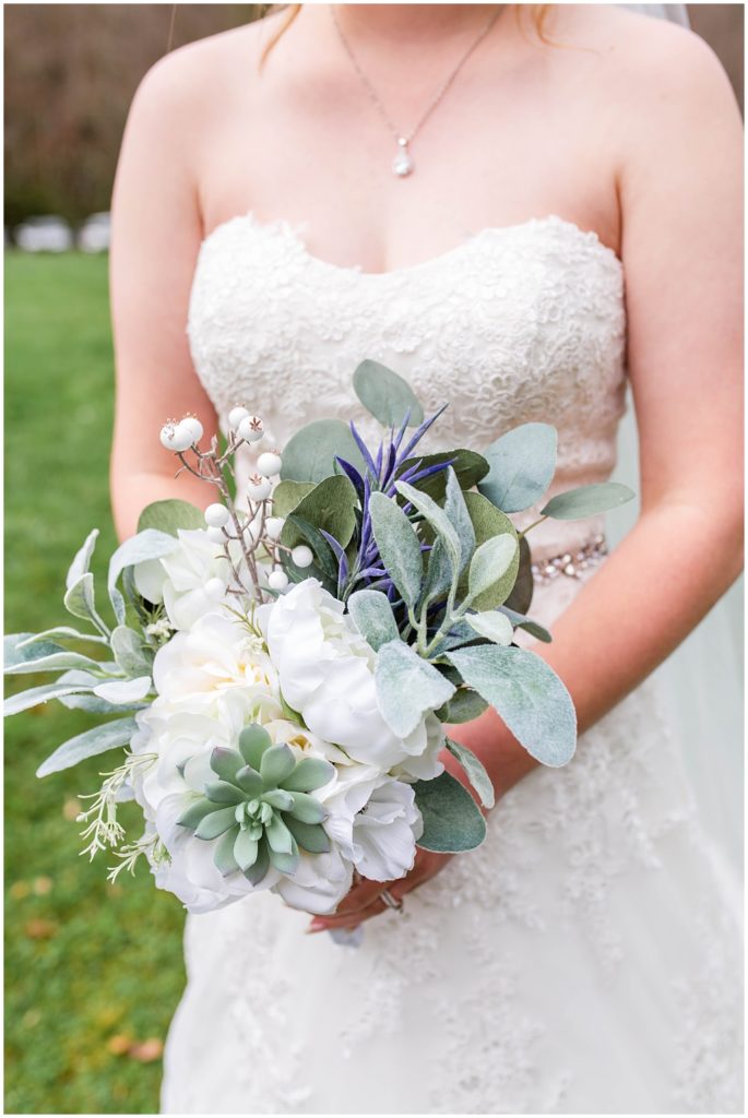Photo of the bride holding her bouquet.