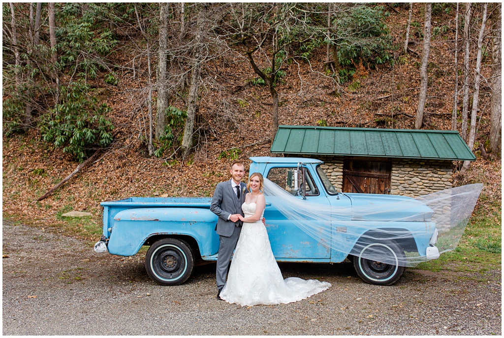 Bride and groom portraits at Camp Daniel Boone with a vintage blue truck.