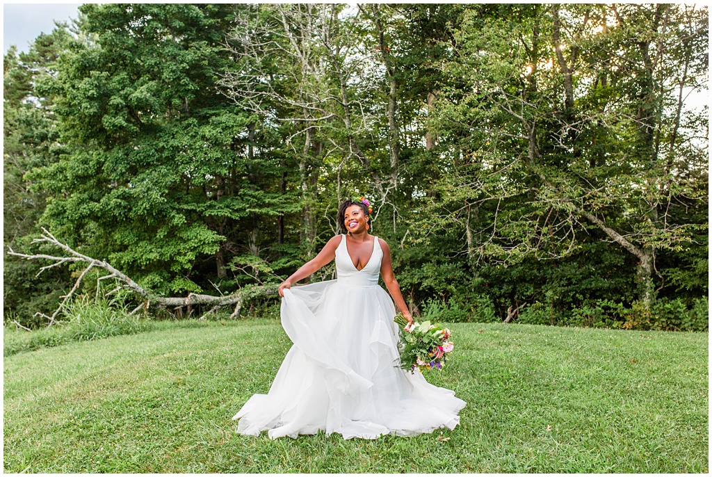 bridal portrait twirling with colorful spring bouquet at The Ridge | Asheville Wedding Photographer