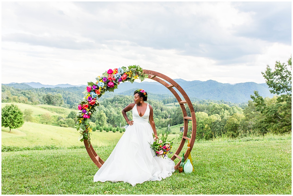 bridal portrait with colorful spring bouquet and circle arch at The Ridge | Asheville Wedding Photographer