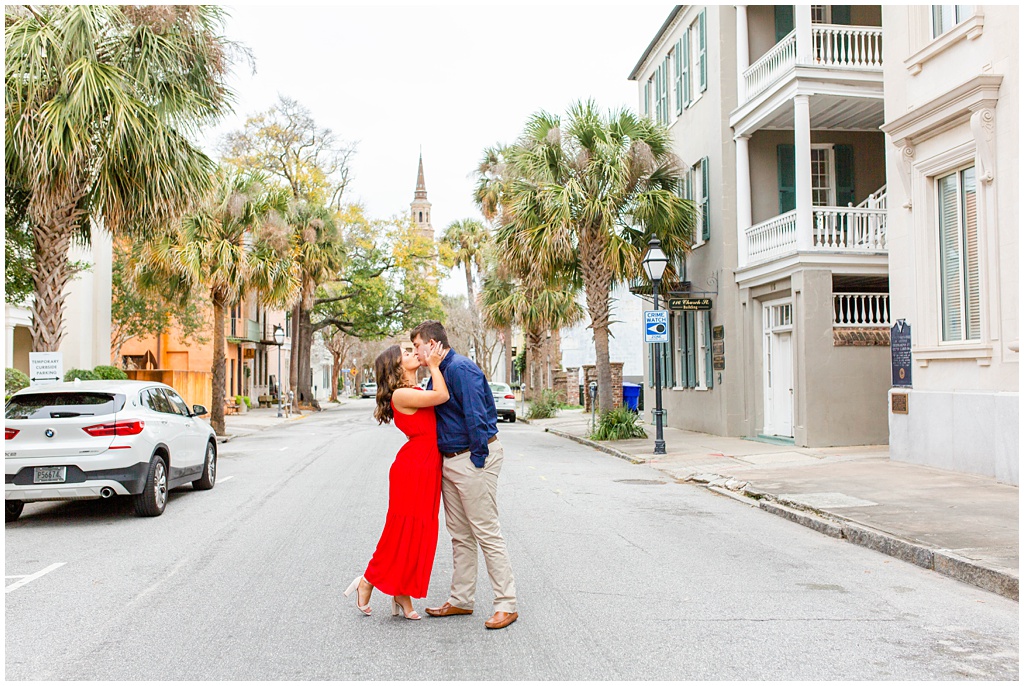 Engagement photos in downtown Charleston with St Philip's Church.