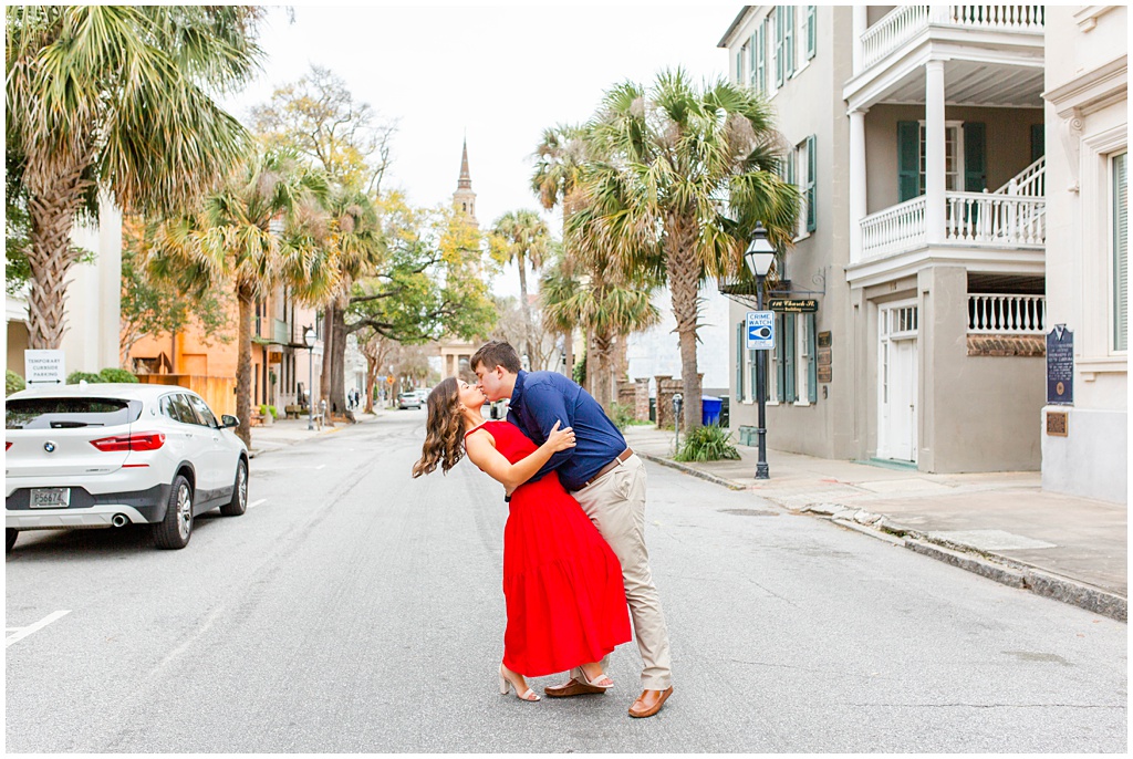 Engagement photos in downtown Charleston with St Philip's Church.