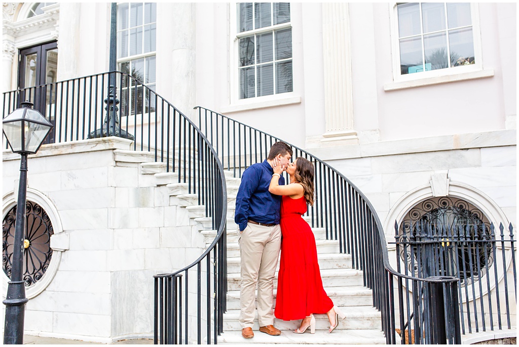 Engagement photos in downtown Charleston on a marble staircase.