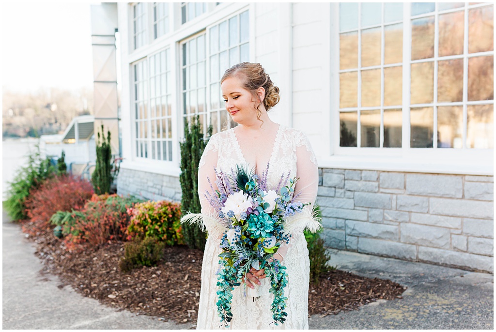 Bridal portrait with purple and green floral arrangement made from Hobby Lobby florals.