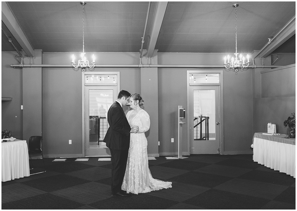 Black and white image of the bride and groom's first dance.