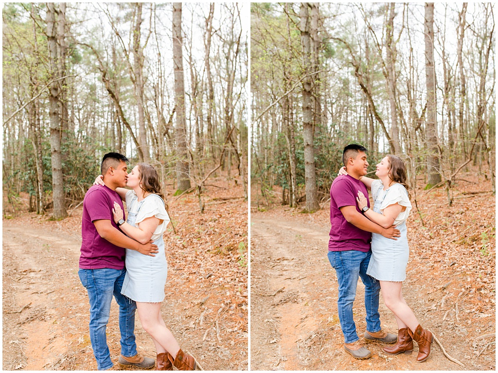 Couples portraits kissing in the woods.