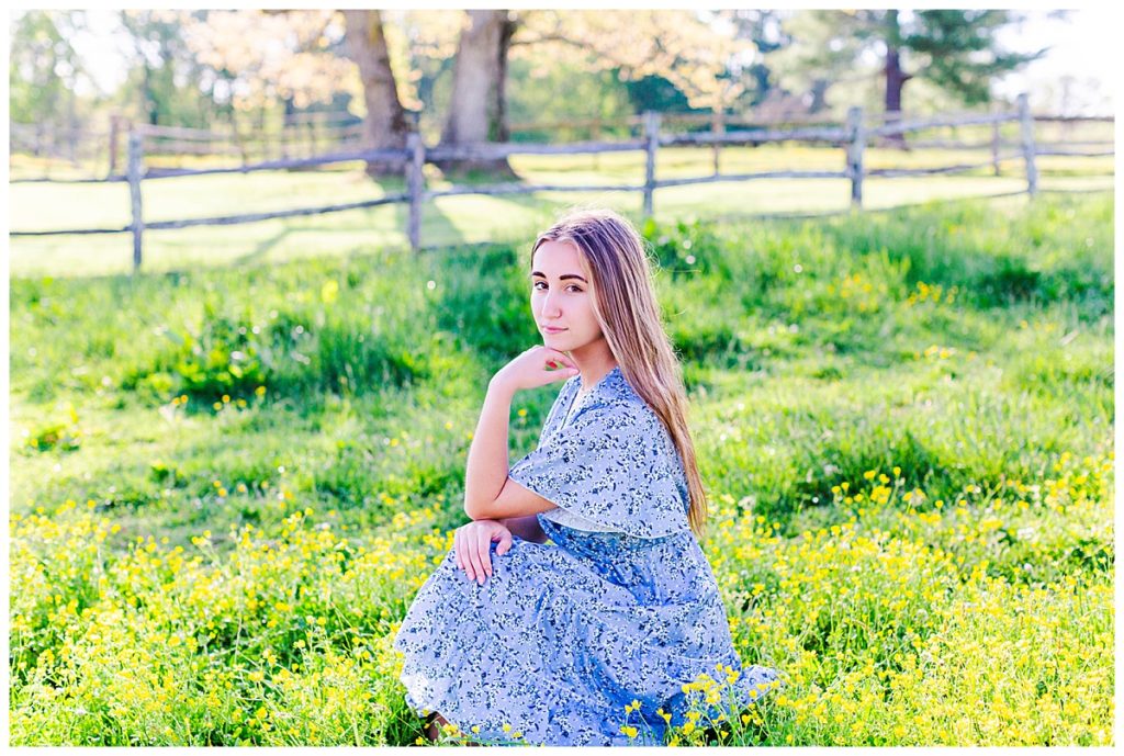Asheville high school senior photo in a blue floral dress at Taylor Ranch in Fairview, NC.
