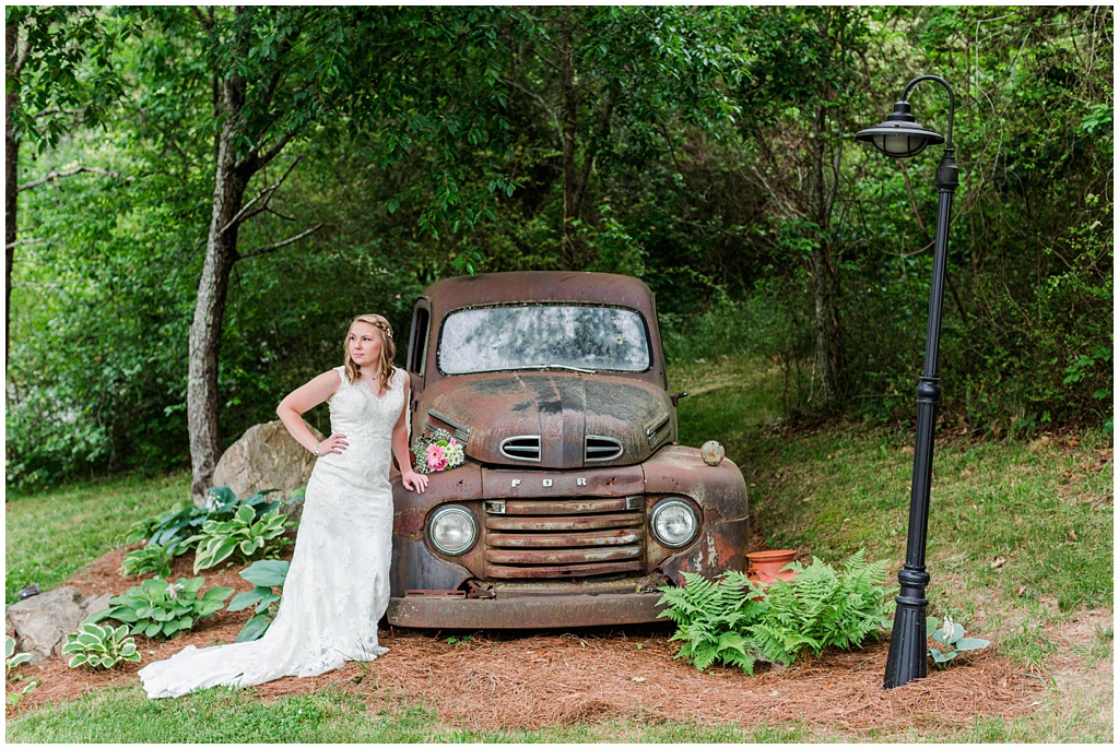 Bridal portrait next to a vintage ford car.