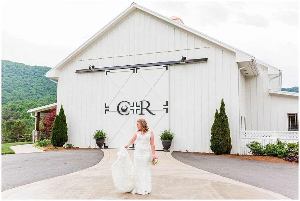 Spring bridal portraits in the mountains of NC at Chestnut Ridge in front of the iconic barn doors.