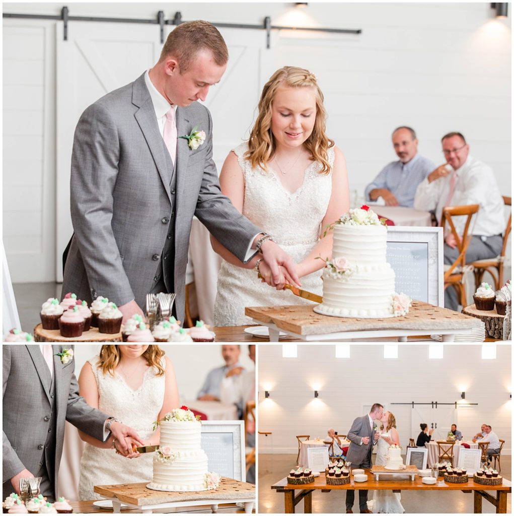 The bride and groom cut their cake together.