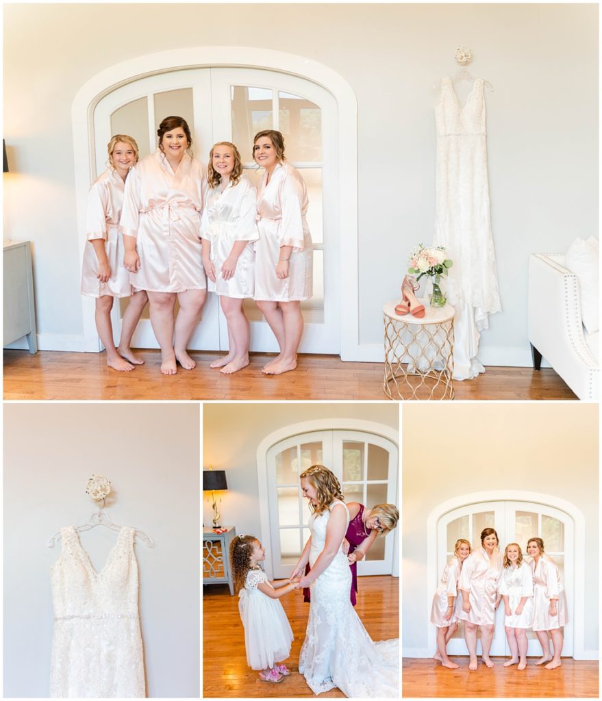The bridal party in matching satin robes getting ready together.