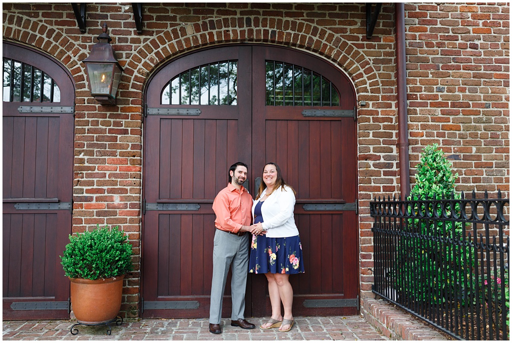Downtown Charleston Engagement photo in front of a wood door.