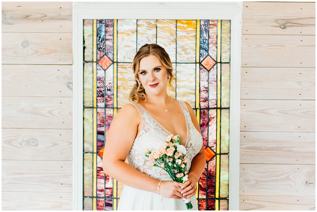 Bridal portrait at Arran Farm's chapel with stained glass windows in the summer.