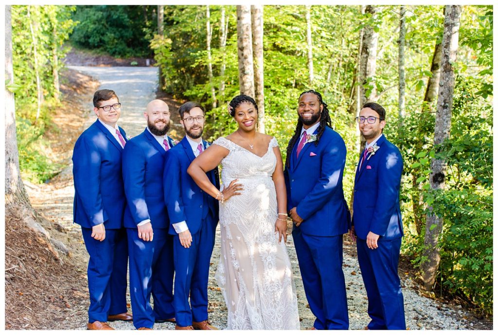 The bride with the groomsmen on the wedding day.