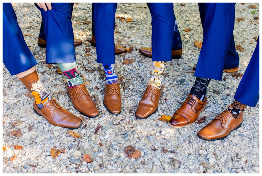 The groomsmen show off their socks that were all Star Wars themed.
