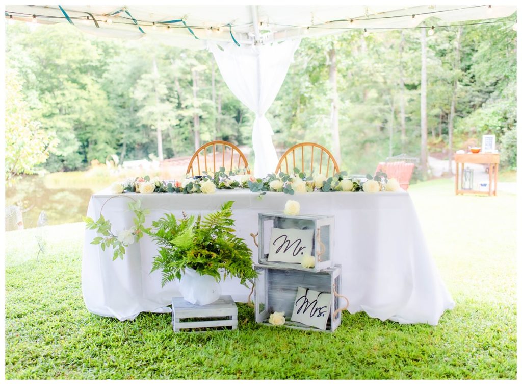 Sweetheart table with rustic decor.