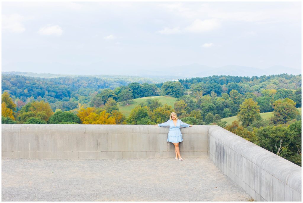 Senior Portraits at the Biltmore estate with views of rolling hills.