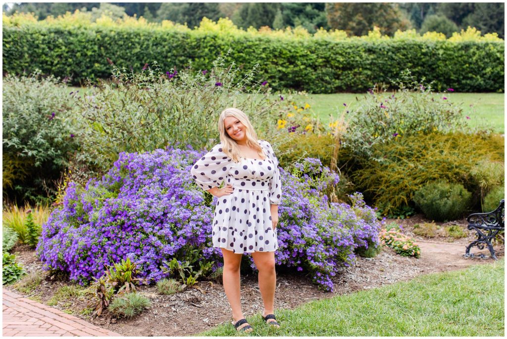 Asheville senior portraits in a garden with purple flowers