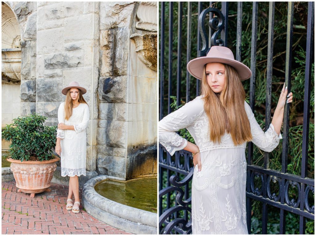 Bailey wore a mid-length white lace dress with a tan hat for her senior portraits.