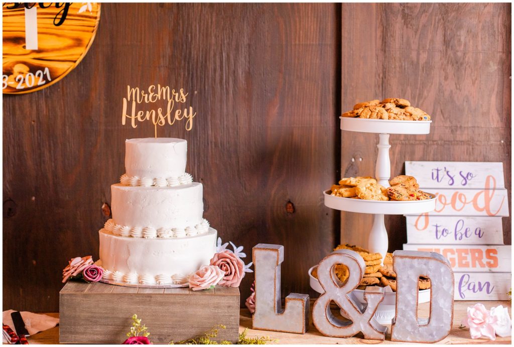 A rustic dessert bar with cake and cookies at the Ridgeview Venue.