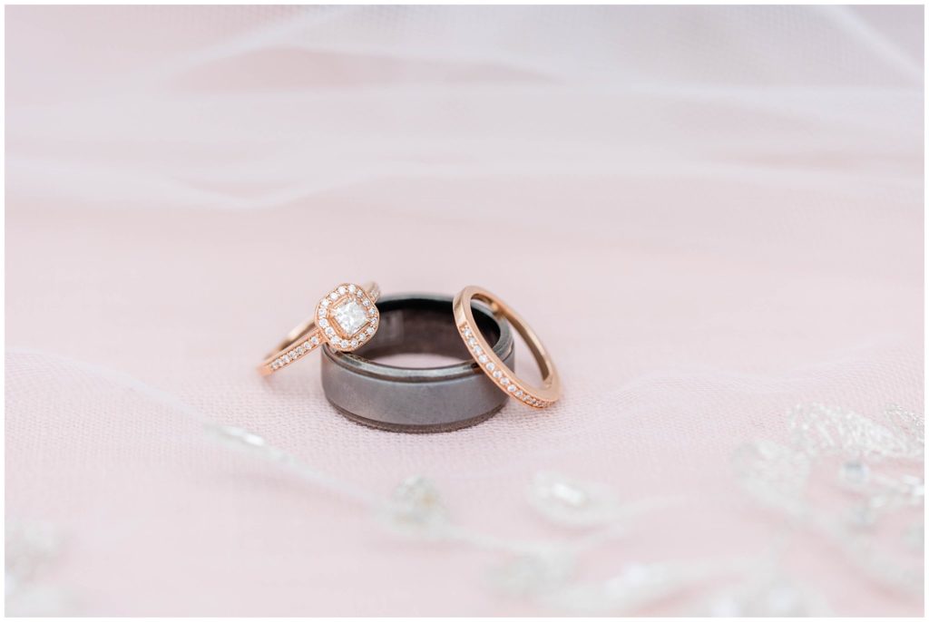 Pink bridal details and wedding bands for a rustic wedding day at the Ridgeview Venue.
