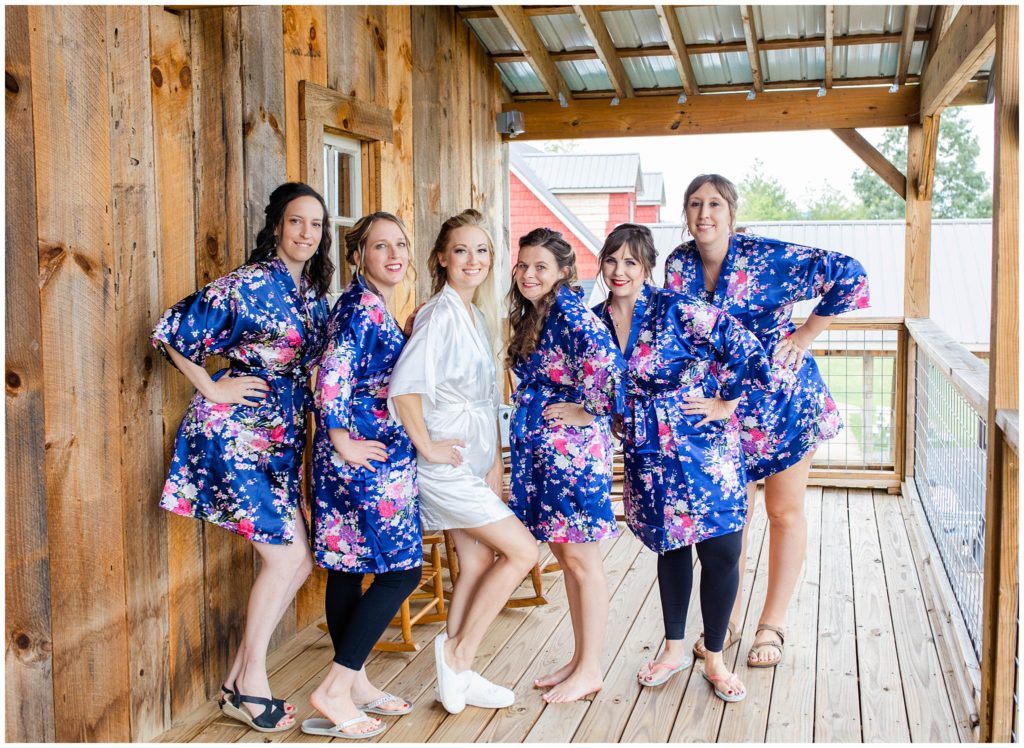 The bride and bridesmaids in print floral robes | Asheville Wedding Photographer