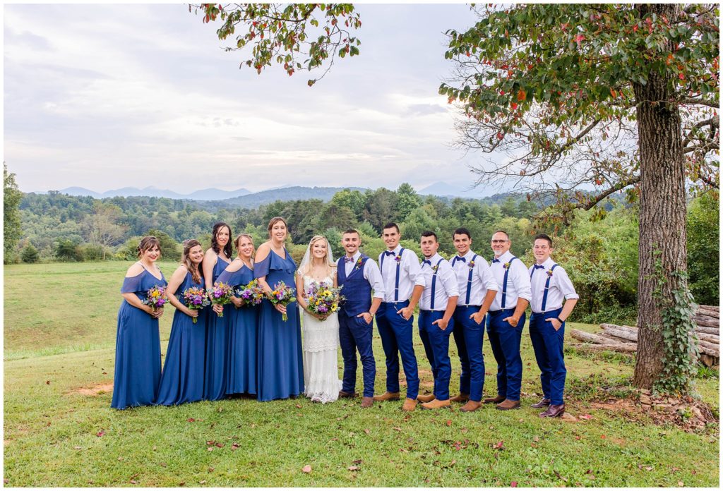 The wedding party all wore blue with colorful flowers | Asheville Wedding Photographer