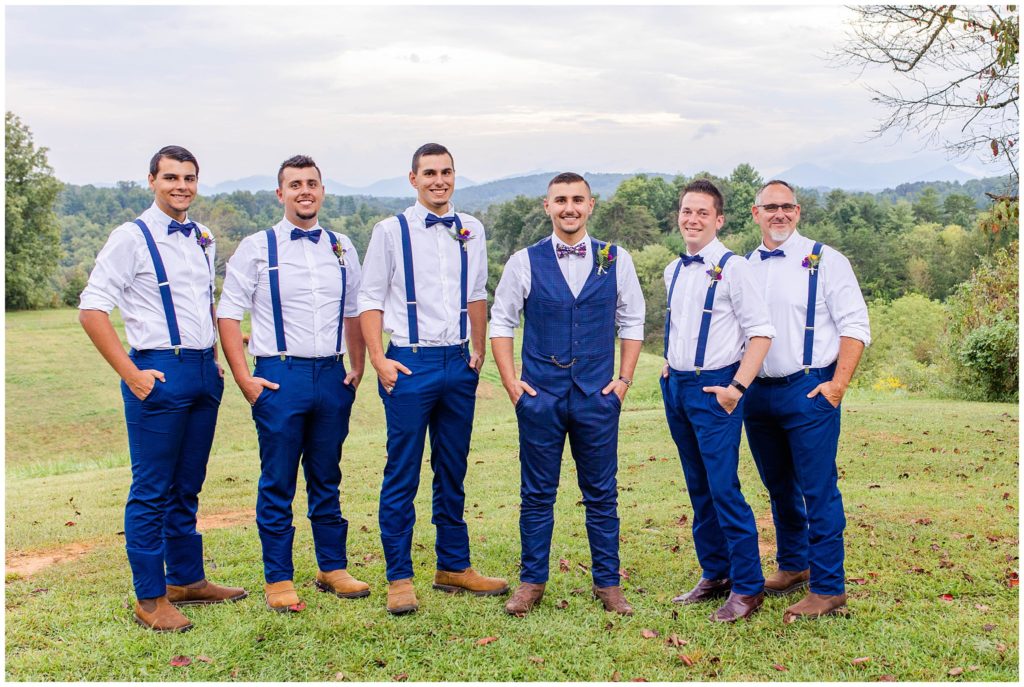 The groom with his groomsmen in matching blue suspenders | Asheville Wedding Photographer