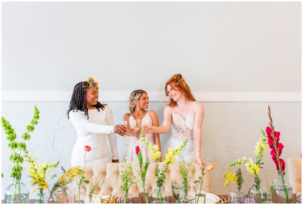 Brunch wedding with florals in vases on a farm table | Tracy Waldrop Photography