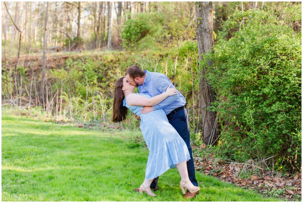 Lane dips Hannah back and kisses her at their engagement session | Asheville Engagement Photographer 