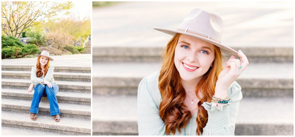 High school senior photos of a girl wearing jeans and a green shirt with a tan hat sitting on steps.
