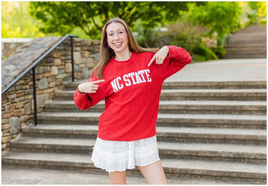 Senior photos with an NC State shirt at the NC Arboretum in Asheville