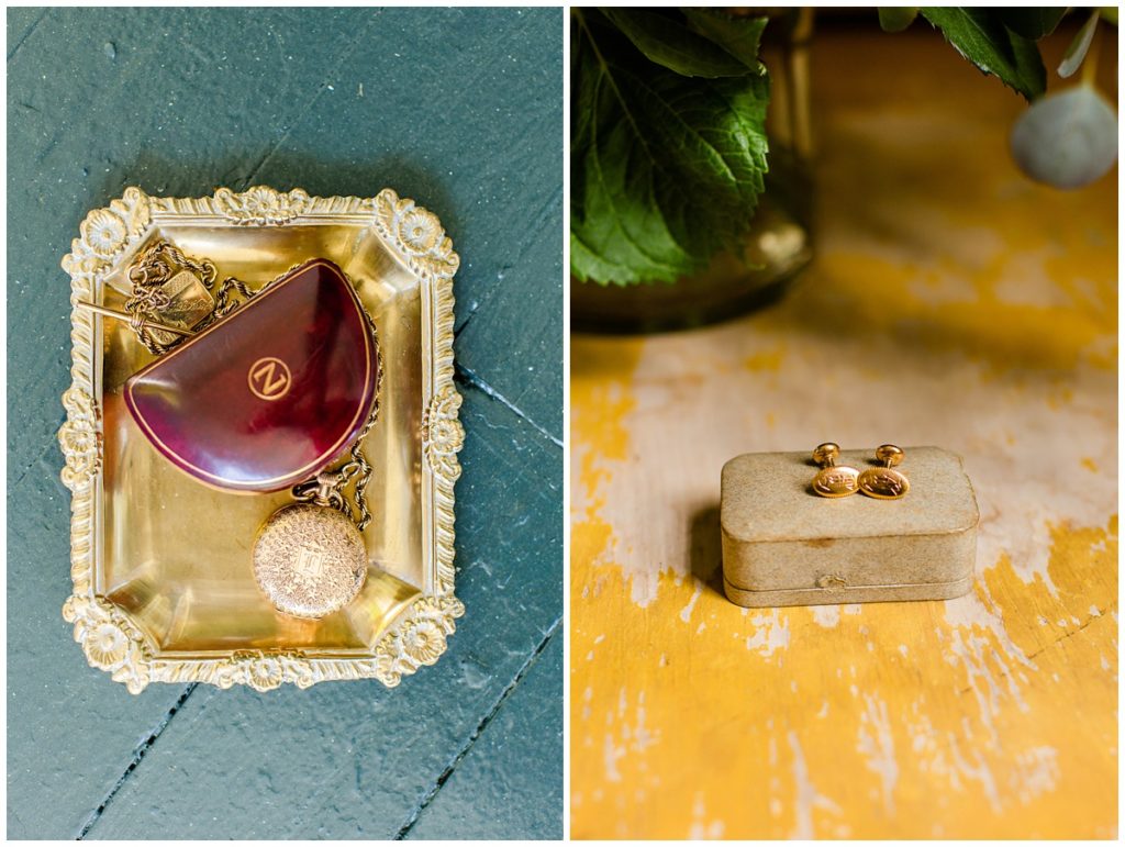 groom's pocket watch and case displayed on gold tray with gold cuff links