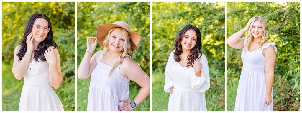 four high school seniors in white dresses doing a photo shoot at a flower farm