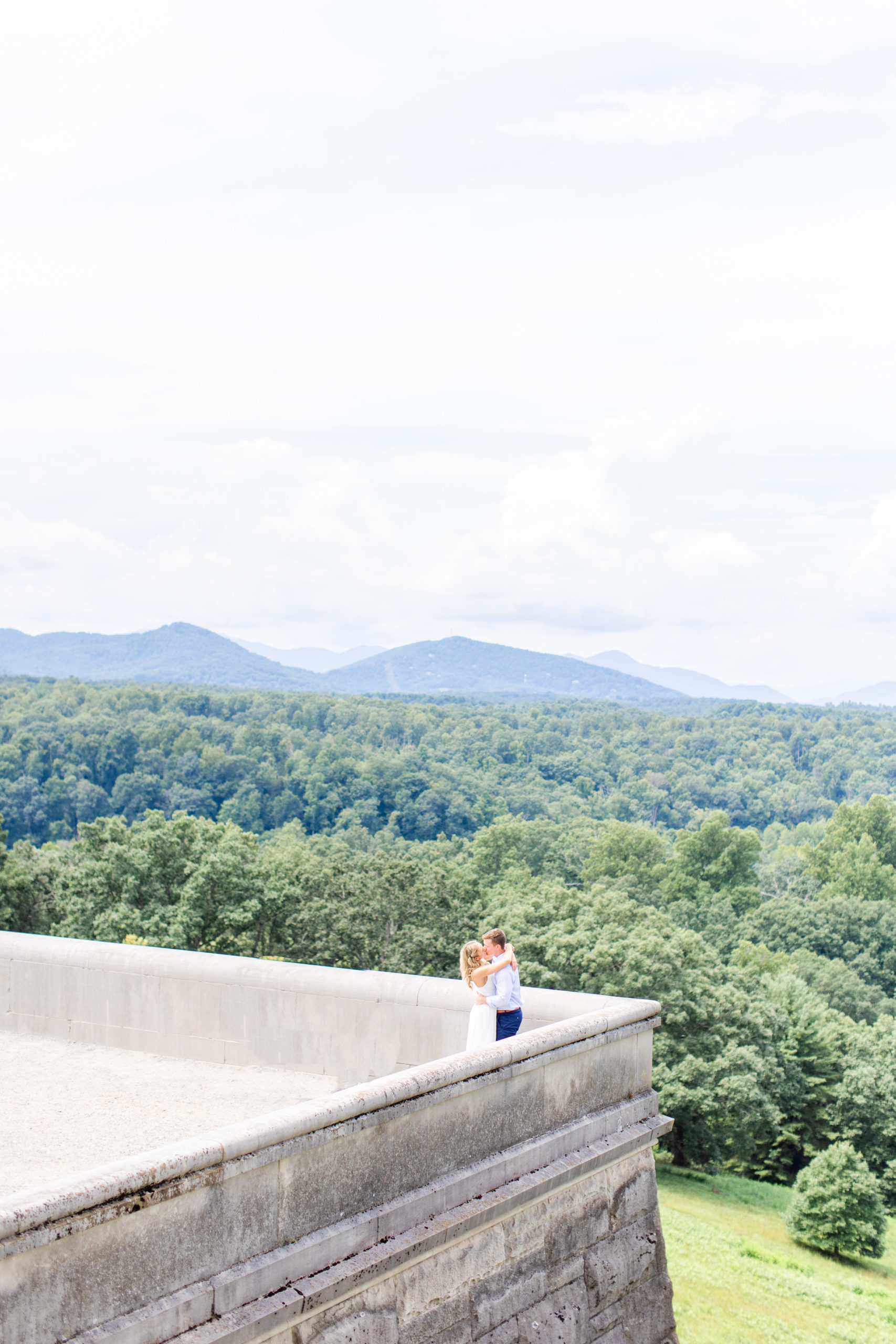 Couple hugging on top of the terrace at Biltmore Estate