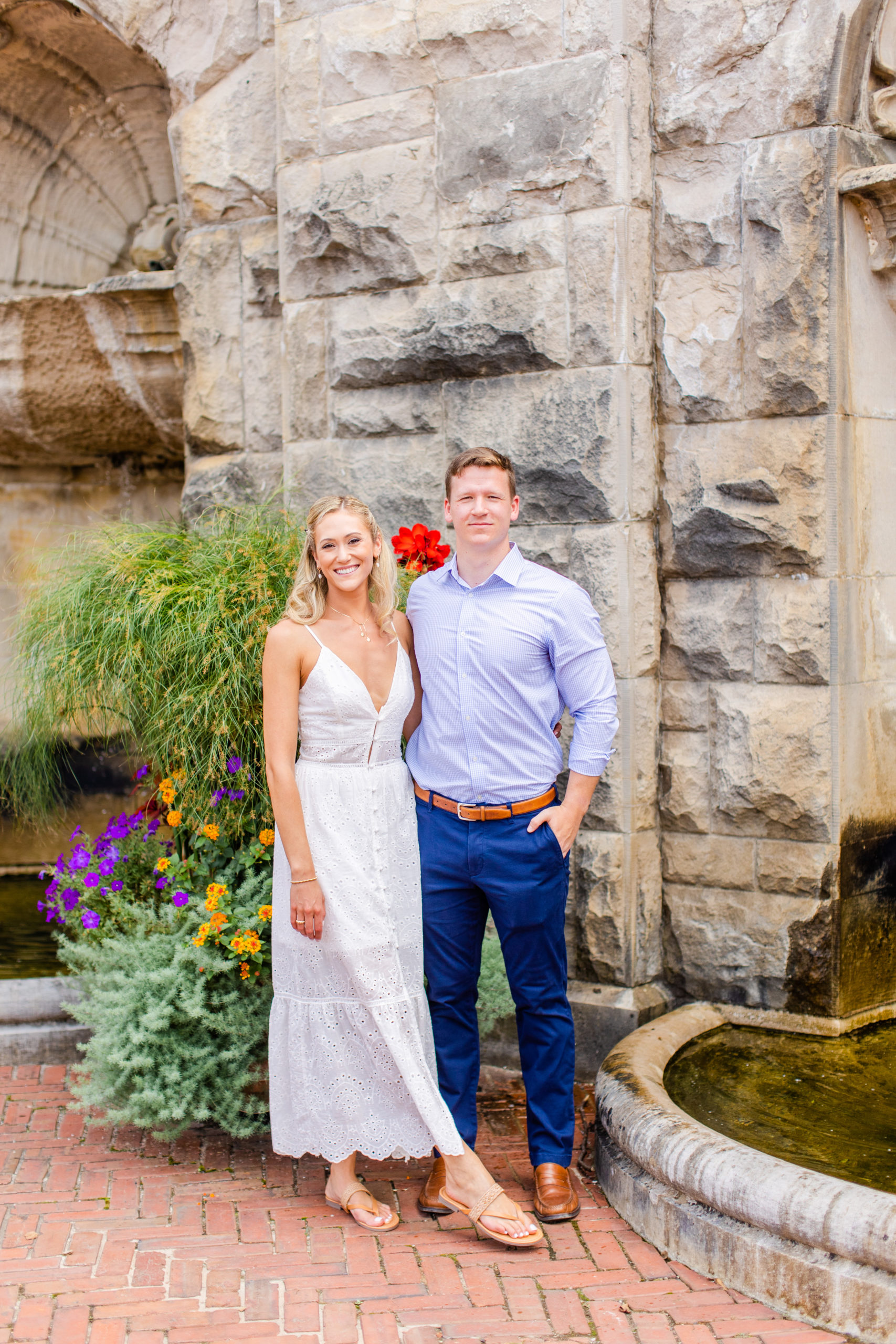 Newly engaged couple poses for photo outside of the Biltmore Estate