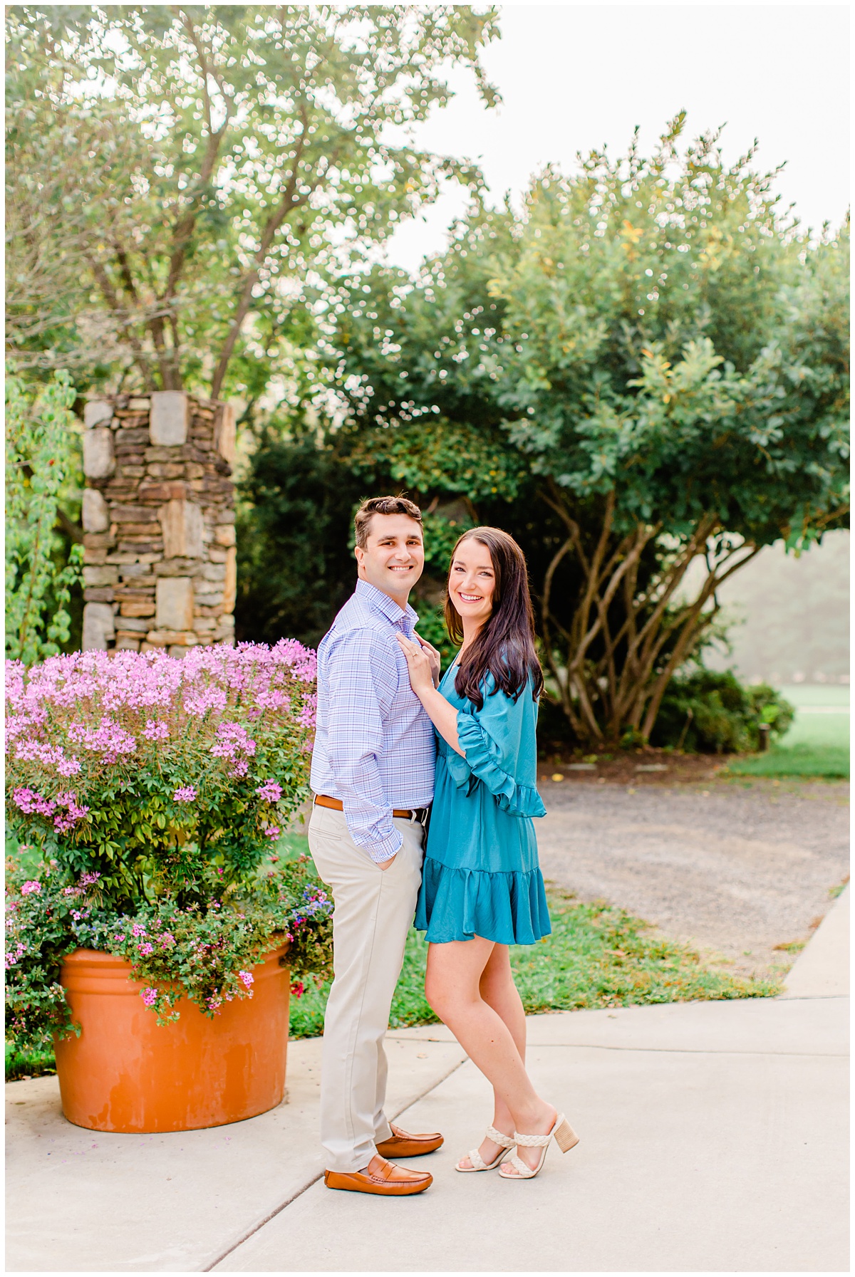 couple posing for their outdoor engagement session