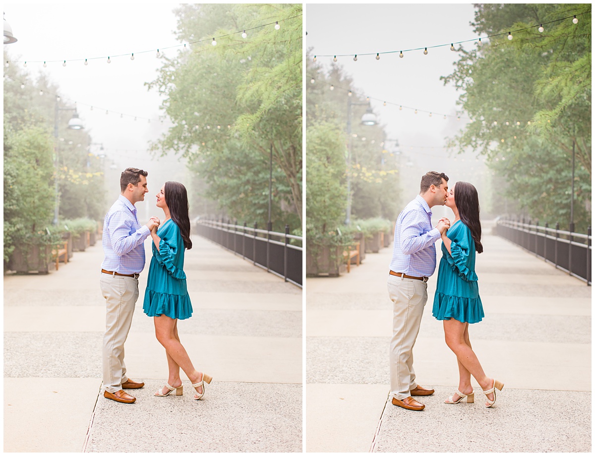 couple poses for their engagement session outdoors while it's foggy