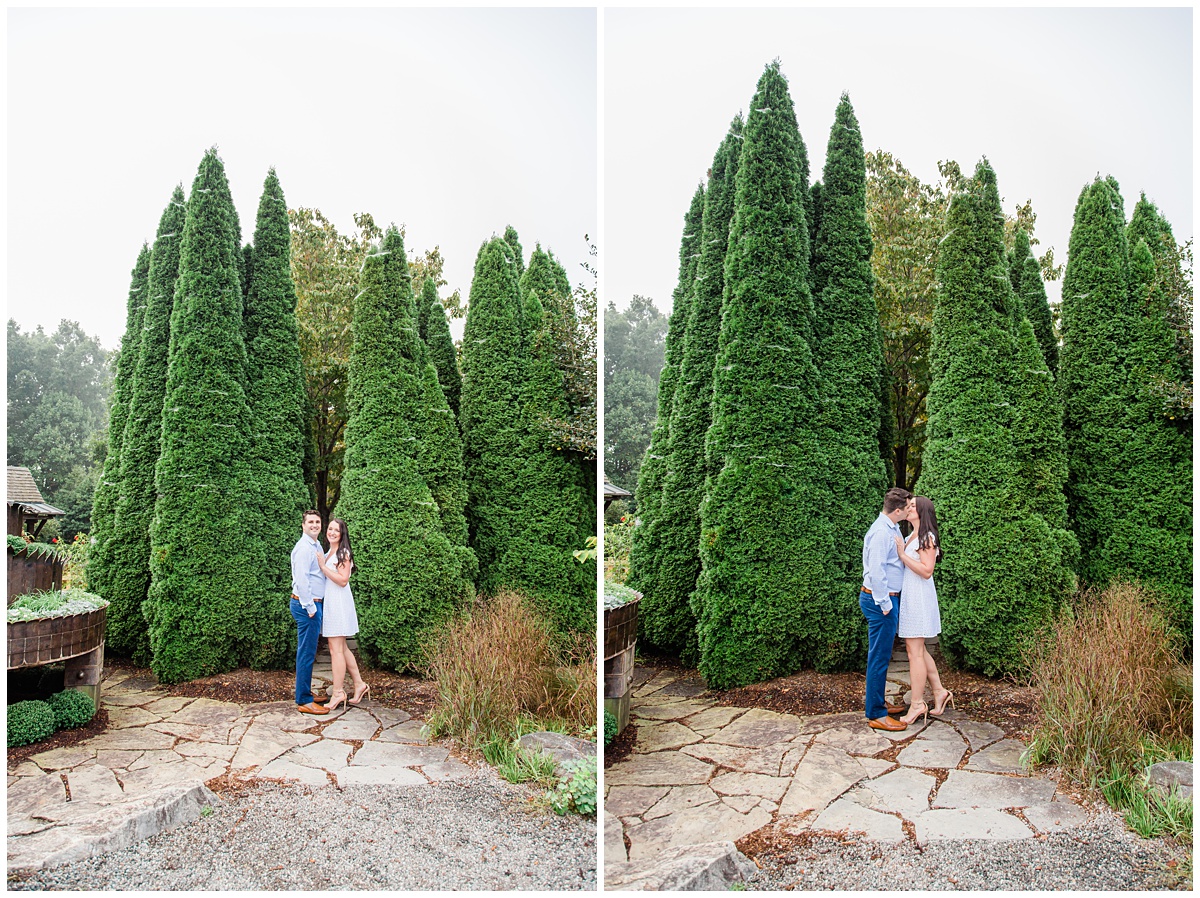 couple poses outdoors for their engagement photo shoot