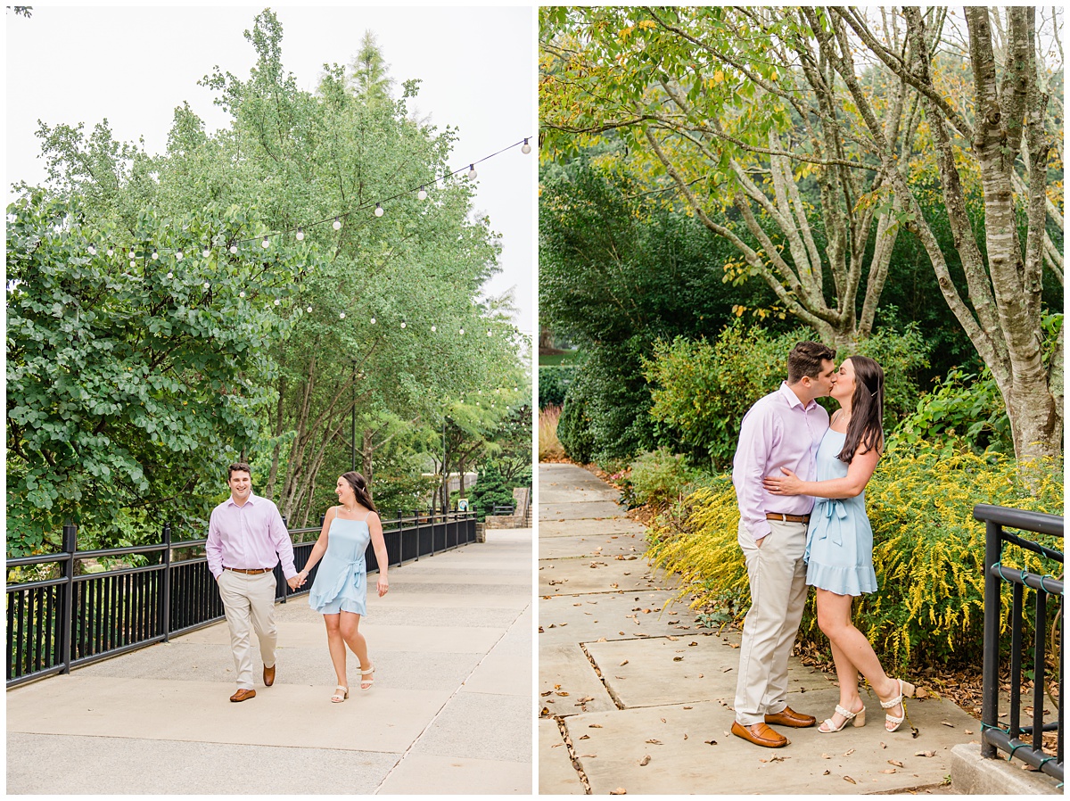 Couple holding hands and kissing for their Asheville engagement session at the NC Arboretum