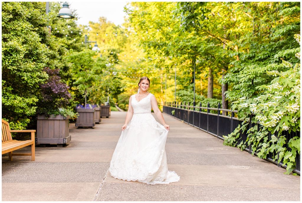 bride poses for her portrait at the NC Arboretum