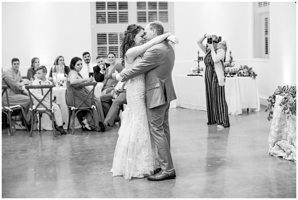 black and white photo of couple sharing first dance